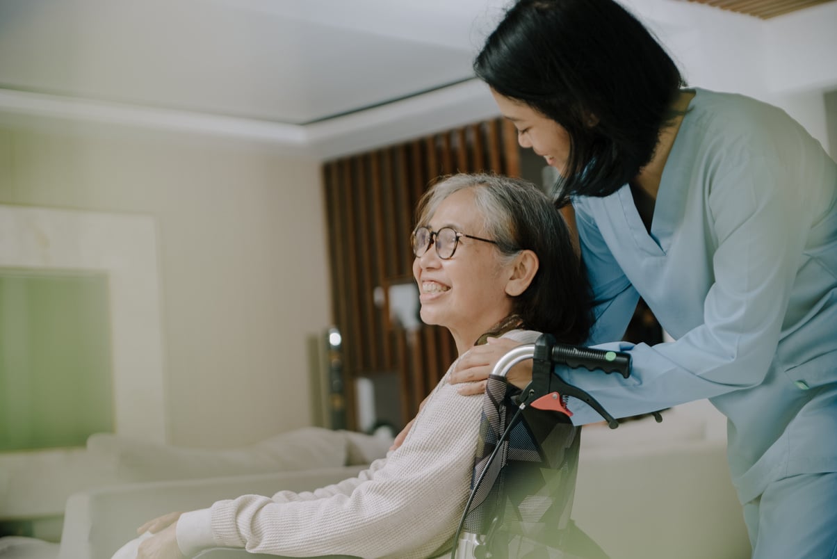 Nurse Taking Care of an Elderly Woman 